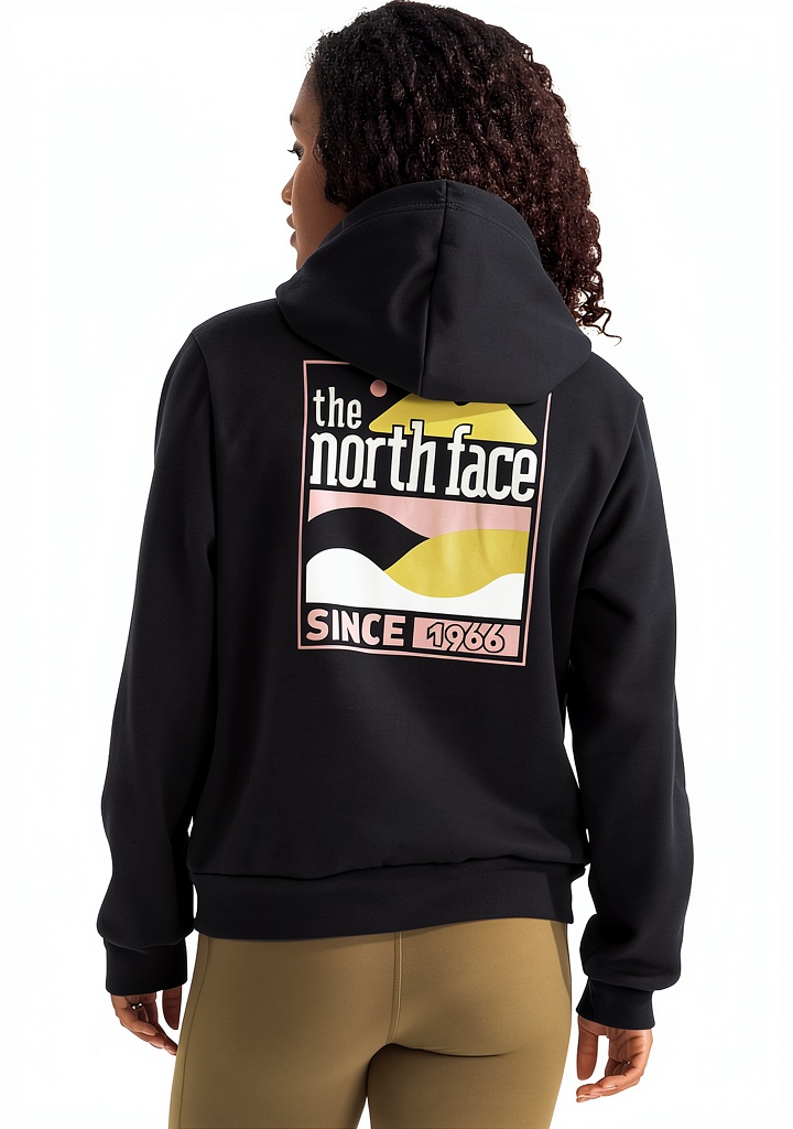 The North Face women's hoodie in White Dune color on a hiking trail