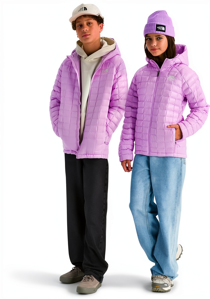 Teen wearing The North Face Thermoball Jacket on a forest trail