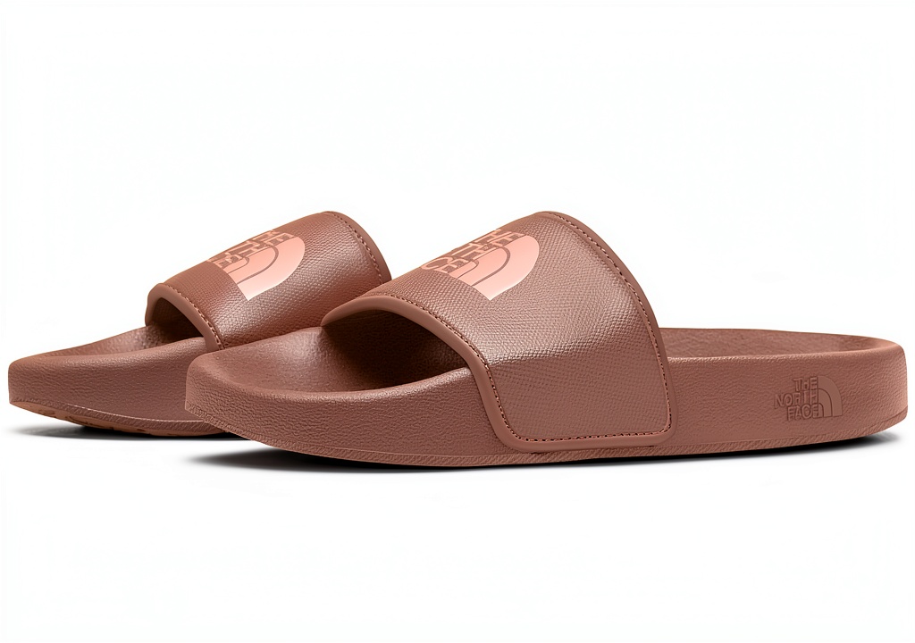 The North Face Women's Base Camp Slides III in Moonstone Grey color on a sandy beach