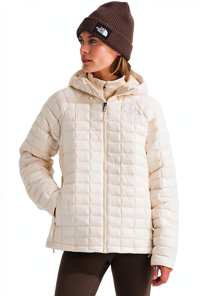 The North Face Thermoball Hooded Jacket in Mars Dust color on a hiking trail