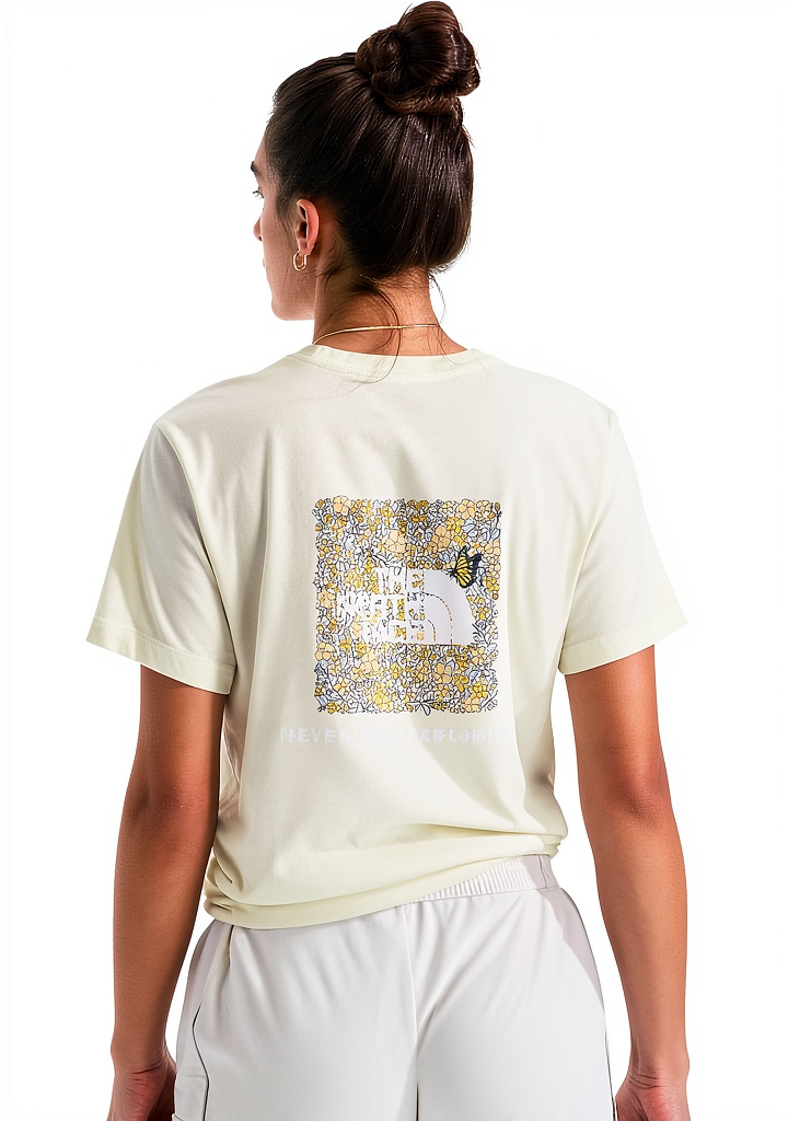 Woman wearing The North Face Floral Box Tee on a mountain trail