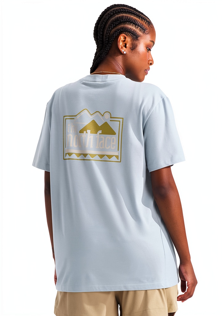 Woman wearing The North Face Explore Tee on a mountain trail