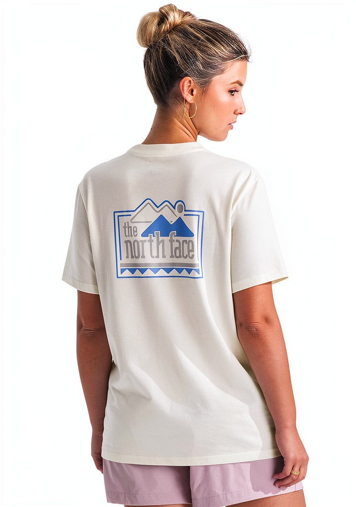 Woman wearing The North Face Explore Pin Tee on a hiking trail